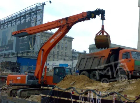 Гусеничный экскаватор с грейфером 26 метров в аренду с оператором